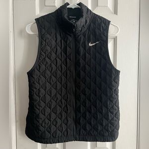 Black Nike vest.